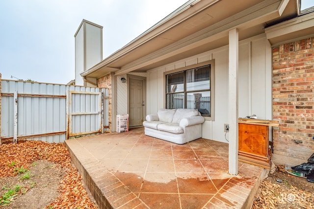 property entrance with a patio area