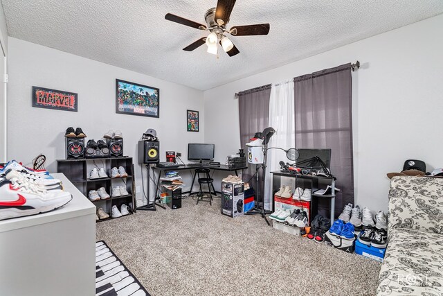 office space featuring ceiling fan and a textured ceiling