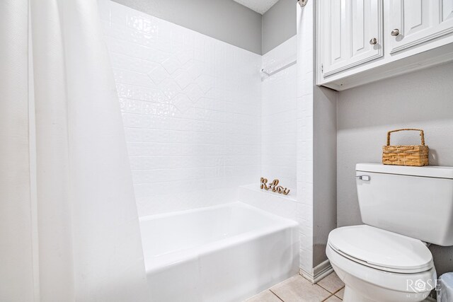 bathroom with tile patterned flooring, toilet, and shower / tub combo with curtain