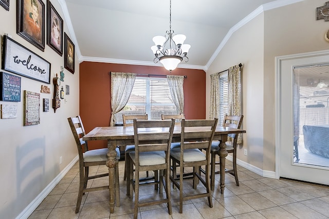 dining area featuring vaulted ceiling, an inviting chandelier, and ornamental molding