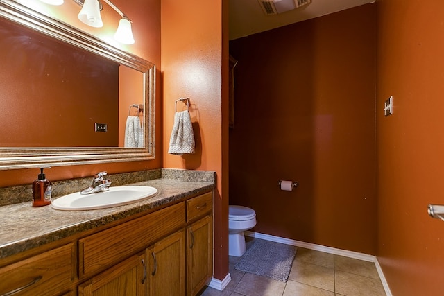 bathroom featuring tile patterned floors, visible vents, toilet, baseboards, and vanity