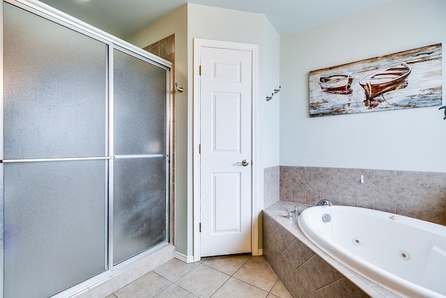 full bath featuring tile patterned floors, a tub with jets, and a shower stall