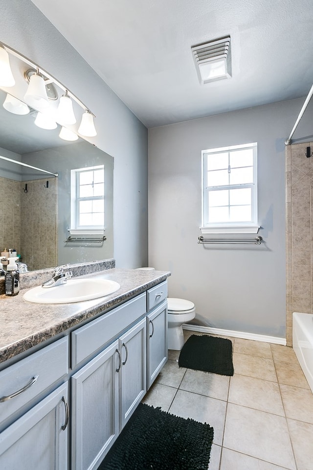 full bath featuring tile patterned floors, visible vents, toilet, tub / shower combination, and vanity