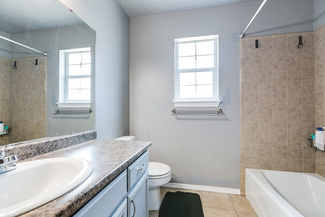 full bath featuring tile patterned flooring, baseboards, shower / washtub combination, toilet, and vanity