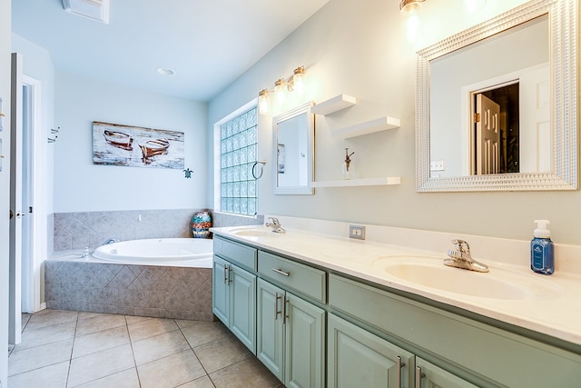 bathroom with a sink, a garden tub, double vanity, and tile patterned flooring