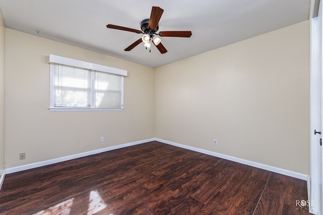 spare room featuring ceiling fan and dark hardwood / wood-style flooring