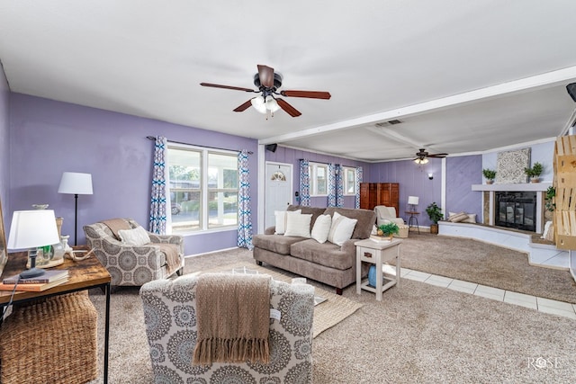 living room featuring ceiling fan, tile patterned floors, and beam ceiling