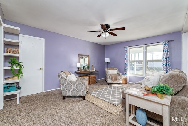 sitting room featuring ceiling fan and carpet