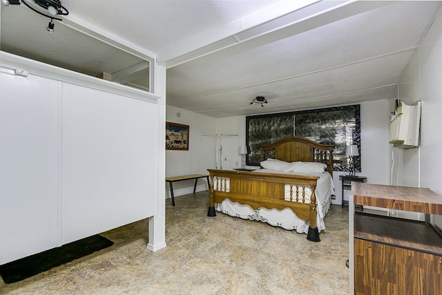 bedroom featuring a wall unit AC