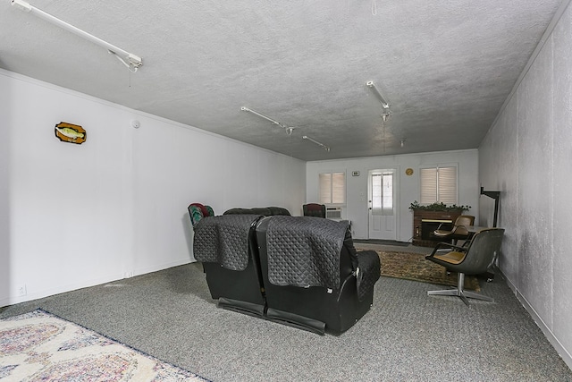 interior space with baseboards and a textured ceiling