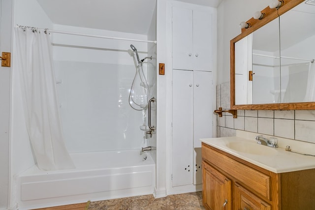 full bath with vanity, backsplash, and shower / tub combo