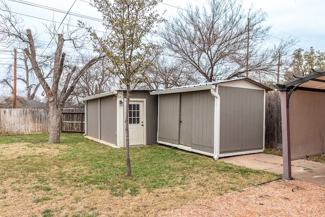 view of outdoor structure featuring a lawn