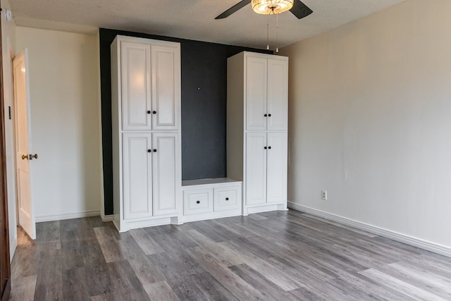 unfurnished bedroom with light hardwood / wood-style floors and ceiling fan