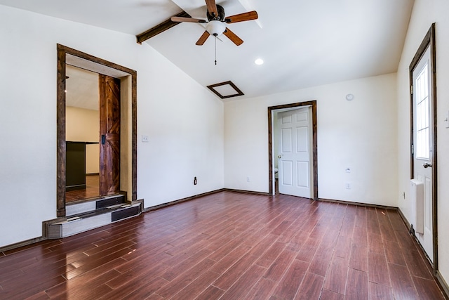 empty room featuring hardwood / wood-style floors, lofted ceiling with beams, and ceiling fan