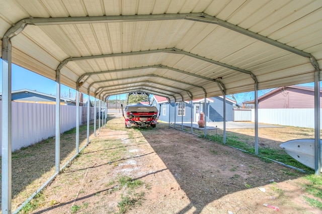 view of vehicle parking with a carport