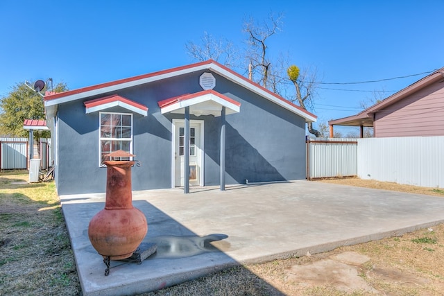 back of house featuring a patio