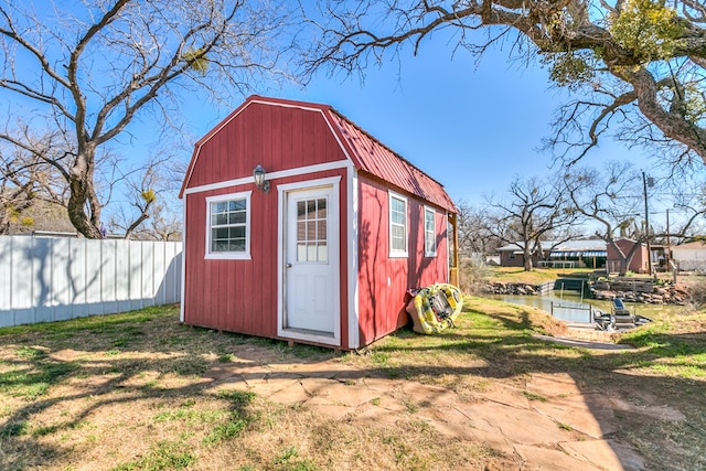 view of outbuilding featuring a lawn