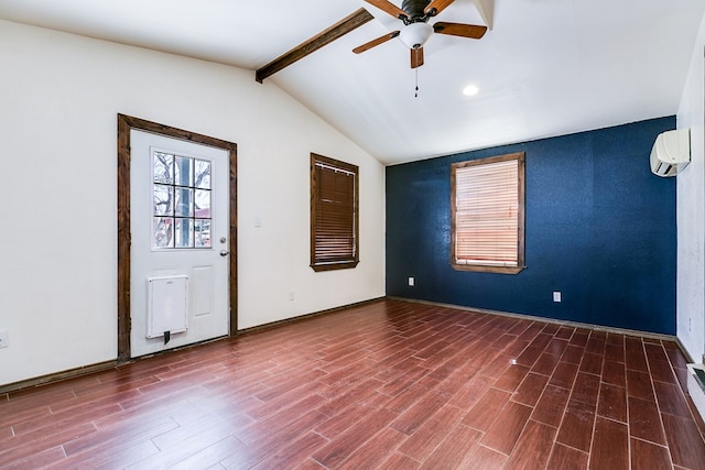 spare room with vaulted ceiling with beams, wood-type flooring, a wall unit AC, and ceiling fan