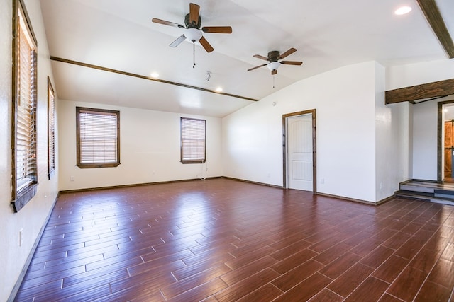 spare room with vaulted ceiling and dark hardwood / wood-style floors