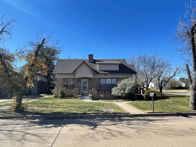 view of front of home with a front yard