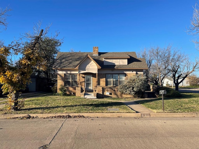 view of front of home with a front yard