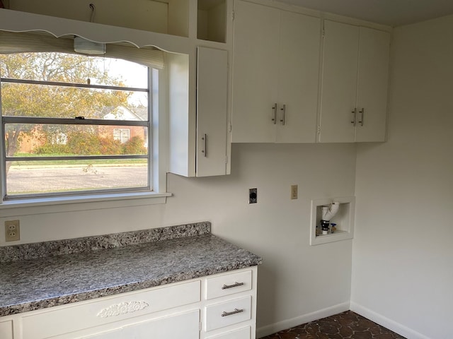 laundry room featuring cabinets, hookup for an electric dryer, and hookup for a washing machine