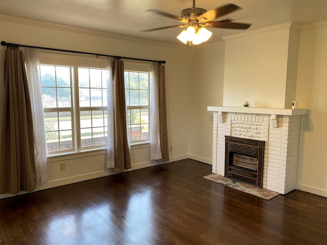 unfurnished living room featuring ornamental molding, dark hardwood / wood-style floors, and a brick fireplace