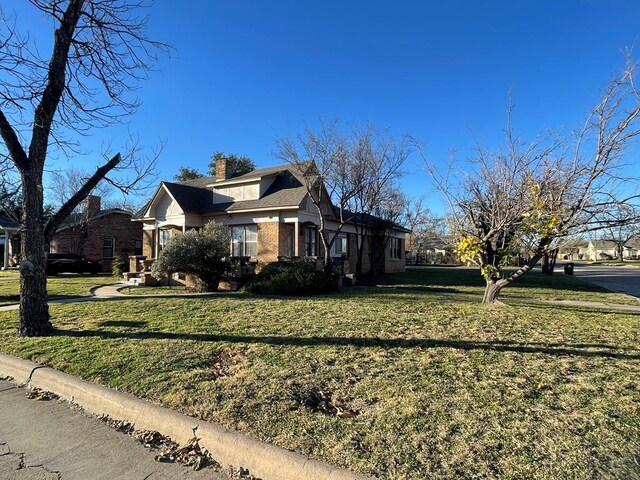 view of home's exterior featuring a lawn