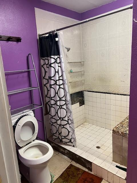 8523 Runion Rd, San Angelo, TX 76905 - bathroom with toilet and a shower stall