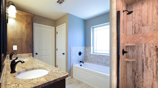 bathroom with plus walk in shower and vanity