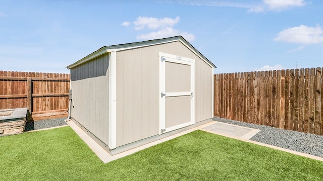 view of outbuilding with a yard