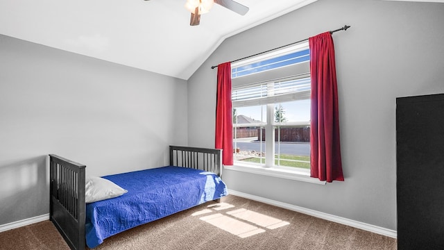 bedroom featuring ceiling fan, lofted ceiling, and carpet