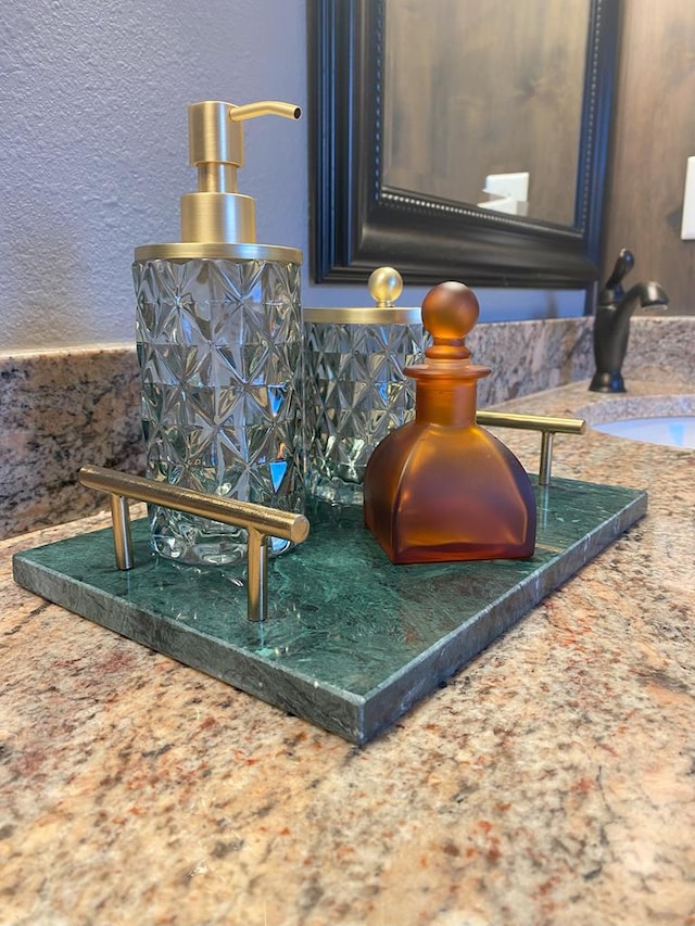 interior details featuring tasteful backsplash and sink