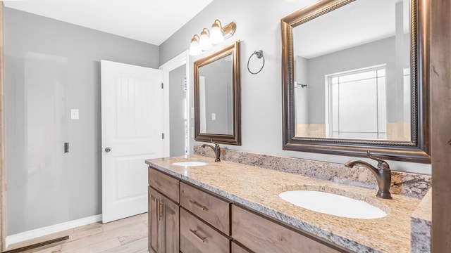 bathroom featuring vanity and wood-type flooring