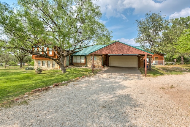 ranch-style house featuring a garage and a front yard