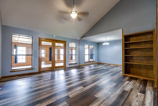 unfurnished living room featuring dark hardwood / wood-style flooring, ceiling fan with notable chandelier, high vaulted ceiling, and a textured ceiling