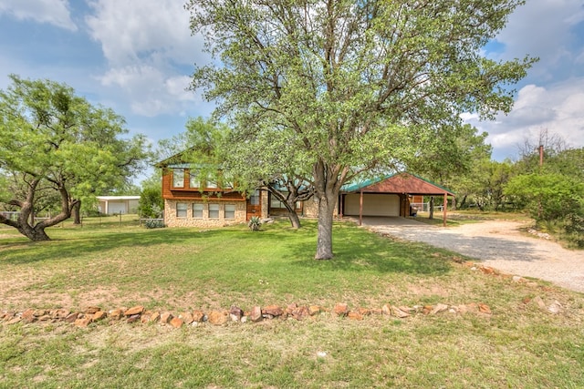 view of front of house with a front lawn and a carport