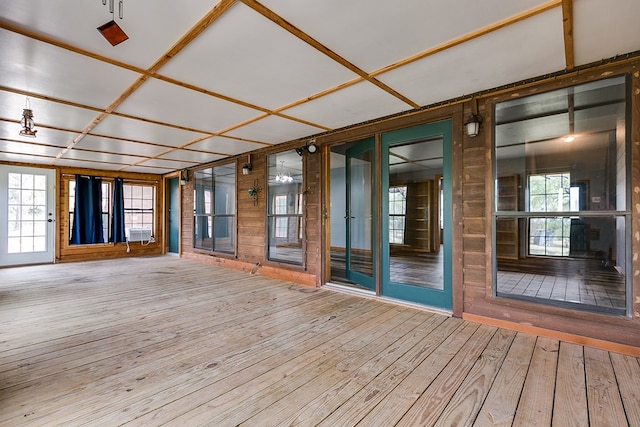 unfurnished sunroom featuring cooling unit and coffered ceiling