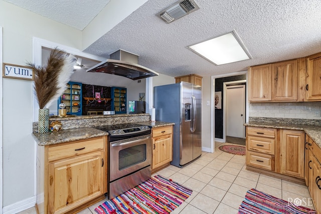 kitchen with visible vents, wall chimney range hood, light tile patterned flooring, baseboards, and appliances with stainless steel finishes