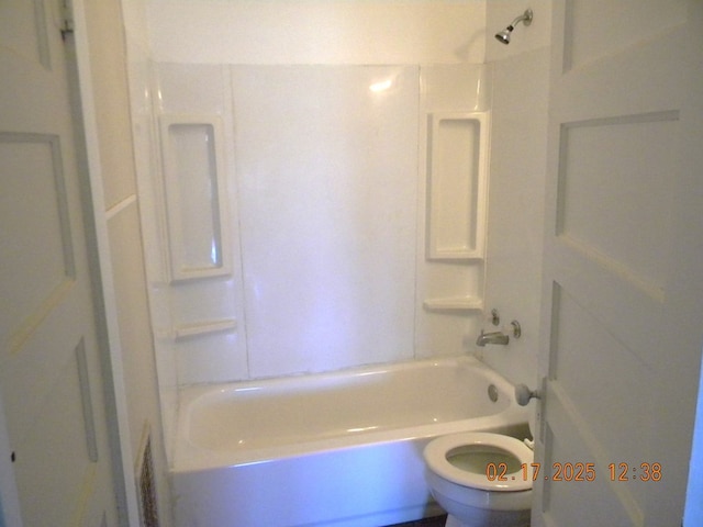 bathroom with toilet and shower / bath combination