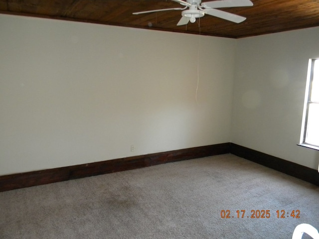 unfurnished room with carpet and wooden ceiling