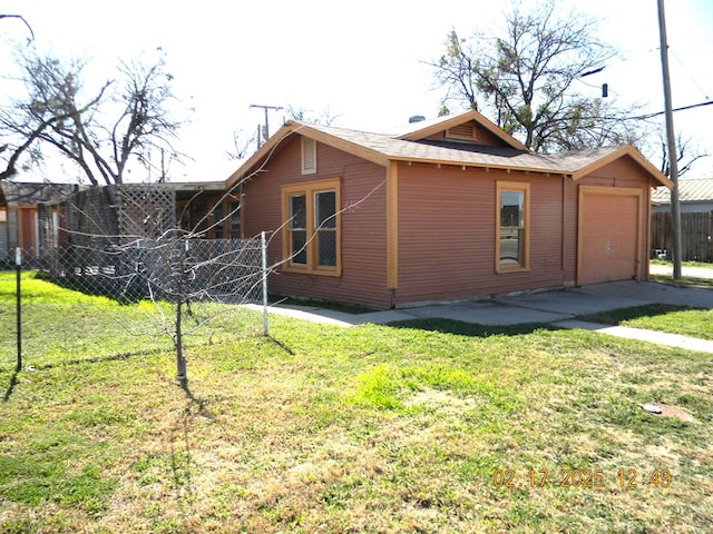 view of home's exterior with a yard and a garage