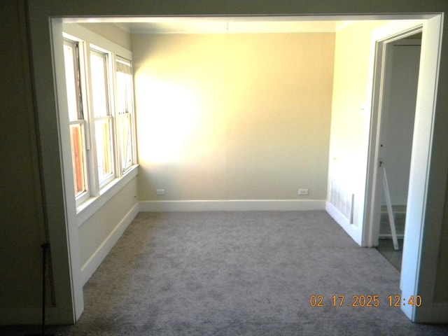 unfurnished room with carpet floors