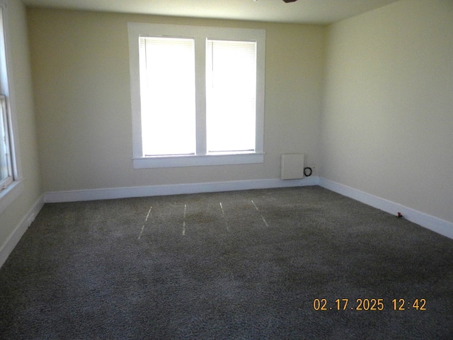 empty room with dark carpet