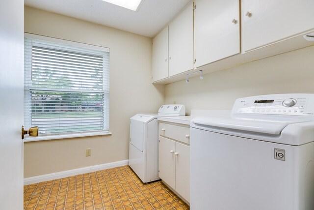 3305 Sierra Ct, San Angelo, TX 76904 - laundry room with cabinet space, baseboards, and washing machine and clothes dryer
