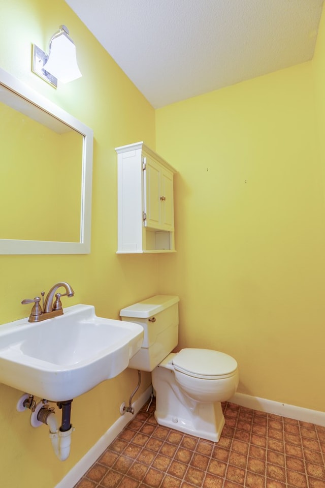 3305 Sierra Ct, San Angelo, TX 76904 - half bath with baseboards, toilet, and a sink