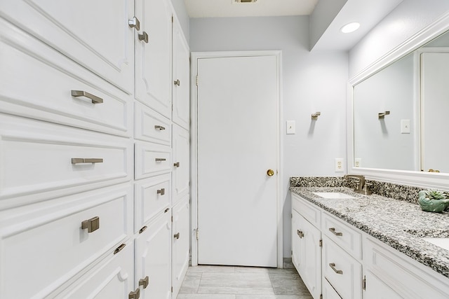 3305 Sierra Ct, San Angelo, TX 76904 - bathroom with double vanity and recessed lighting