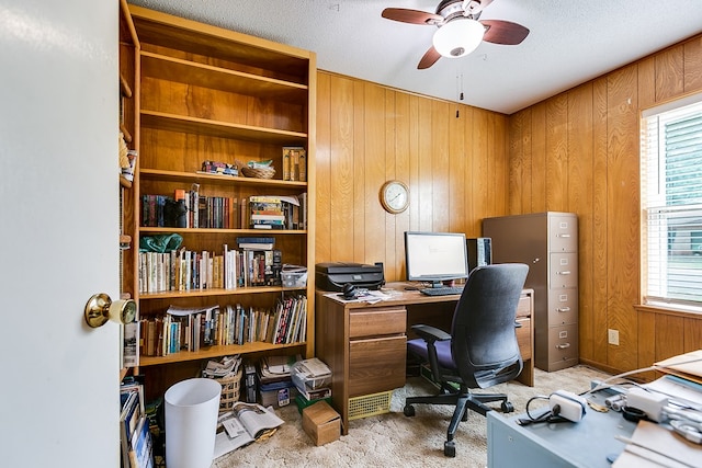 3305 Sierra Ct, San Angelo, TX 76904 - office area featuring light carpet, wood walls, and a ceiling fan