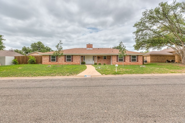 3305 Sierra Ct, San Angelo, TX 76904 - ranch-style house with brick siding and a chimney