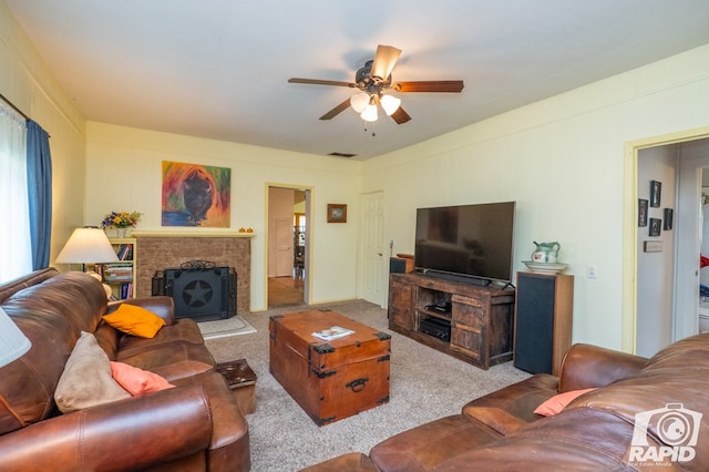 carpeted living room featuring ceiling fan